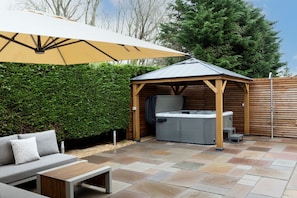 The covered hot tub at Oxwich Retreat, Gower