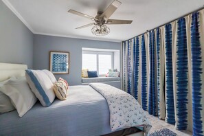 Second bedroom with queen bed and cozy reading nook. Second bathroom is located right outside this room. Large closet with additional bedding if needed for guest in the loft.