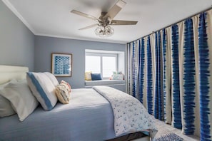 Second bedroom with queen bed and cozy reading nook. Second bathroom is located right outside this room. Large closet with additional bedding if needed for guest in the loft.