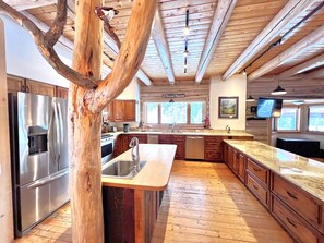 Pass the log tree and enter a kitchen that is fully equipped and will meet most all of your needs!