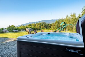 Eight person hot tub with views of Mount Waumbek and Mount Starr King with fire-pit and playground set nearby!