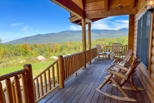 Front entrance to the log cabin. Wrap around porch with views of the Pliny Range including Mount Waumbek (4006') and Mount Starr King. 