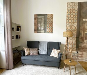 Living/bedroom with sitting area and library