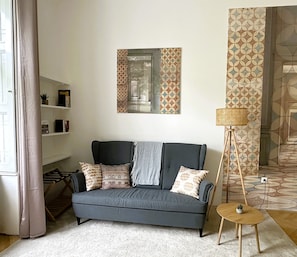 Living/bedroom with sitting area and library
