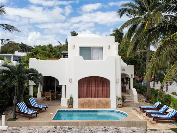 The home is located on a cul-de-sac, with a private front yard pool. 
