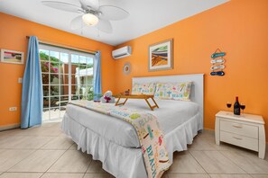 Sink into the plush comfort of this inviting bed, dressed in fresh, crisp linens for a restful night’s sleep. With air conditioning and a large window allowing natural light to flow in, this bedroom is the perfect blend of comfort and tranquility.