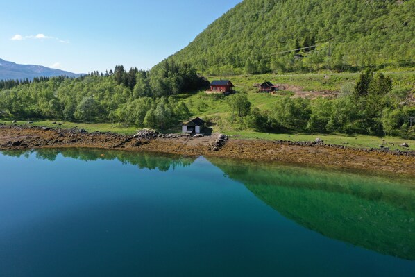 In front of the house by the fjord