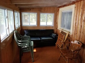 FRONT POURCH WITH FULL SIZE SLEEPER SOFIA AND  STACK CHAIRS