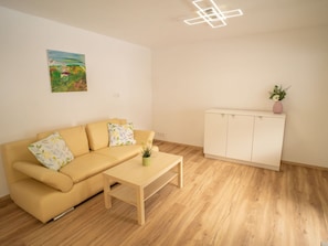 Furniture, Interior Design, Flooring, Floor, Wood Flooring, Couch, Wood, Room, Laminate Flooring, Living Room