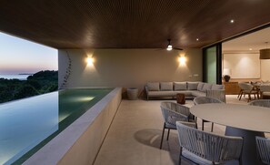 The condo’s open-concept layout seamlessly integrates indoor and outdoor spaces