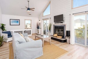 Cozy living area with natural light and deck access