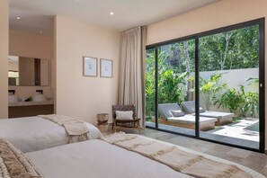 Spacious room with a bohemian design. Large windows with views of the outdoor patio. It has a bathroom.