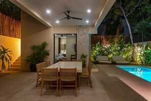 Beautiful and comfortable outdoor dining area located next to the pool. Covered space.
