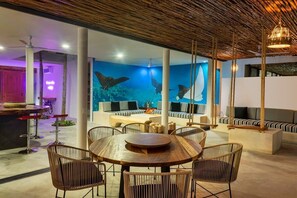 Indoor and outdoor areas connected by large windows. Beautiful outdoor dining area for 6 guests.
