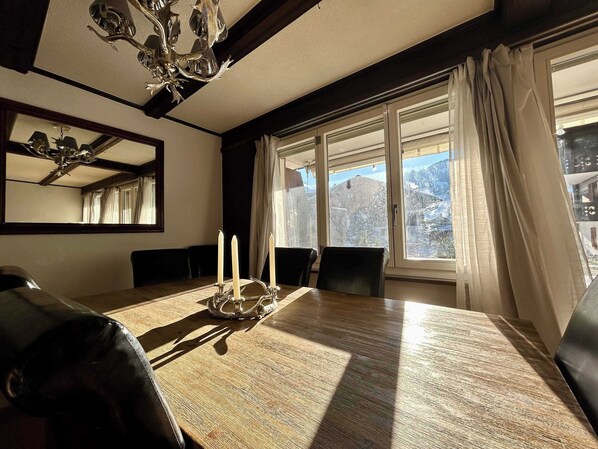 snow mountain view from the living room dinning table 