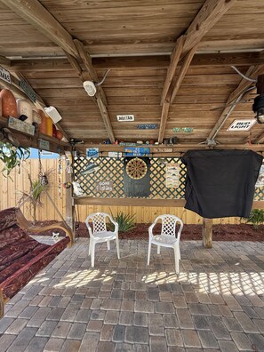 Tiki swing, darts, outdoor tv, corn hole