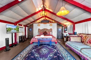 Open layout floorplan cabin with a king bed