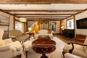 We have plenty of seating in our great room - and a piano!