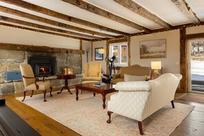 The great room has a fireplace to keep you cozy all night long.