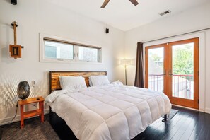 Spacious bedroom with a comfortable King bed & 65" OLED 4K Smart TV.