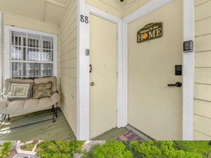 front porch with seating and table to relax or get some work done remotely
