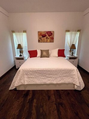Relax in the luxurious and comfortable king size bed in the master bedroom