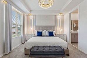 Rest peacefully in the elegantly designed bedroom featuring plush bedding and ample comfort!