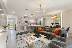 Cozy and spacious living room with comfortable seating and a smart TV for entertainment!