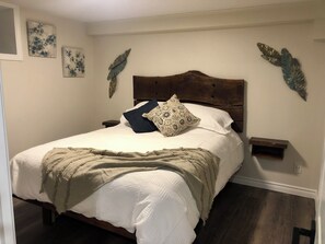 Custom queen size bed with live-edge headboard. 