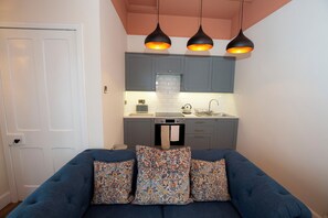 Kitchen, living room, dining area.