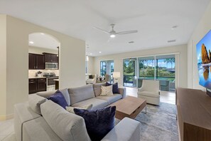 Living Room with 75" TV and Sunset Waterfront Views
