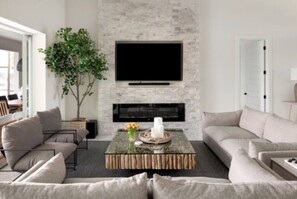 Cozy/Comfy couches & chairs, Fireplace, Big Screen TV & Sound bar/subwoofer.