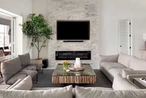 Cozy/Comfy couches & chairs, Fireplace, Big Screen TV & Sound bar/subwoofer.