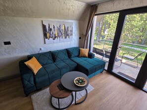 Corner seat, Club table, and Painting