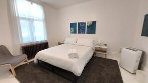 Modern main floor ~ bedroom 1, with queen bed