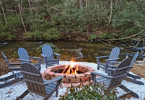Gather around the fire pit for stargazing and storytelling, accompanied by the soothing sounds of the creek nearby.
