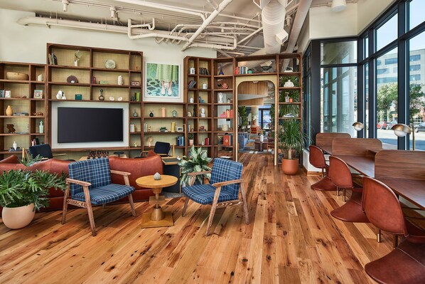 A thoughtfully designed space blending comfort and productivity, featuring warm wood tones, stylish seating, and an inviting atmosphere for work or relaxation.
