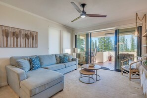 Bright, breezy living room opens directly onto the lanai—bringing the outdoors in with effortless flow.