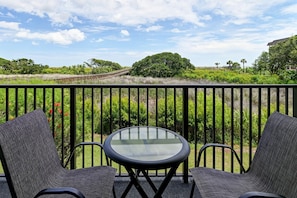 Enjoy beautiful views of the dunes and ocean beyond right from the balcony.