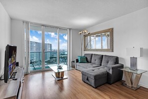 Beach Getaway: Modern 2BR Condo Pool & Gym Access (7604)