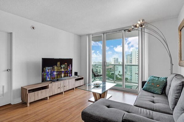 Beach Getaway: Modern 2BR Condo Pool & Gym Access (7608)