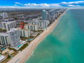 Beach Getaway: Modern 2BR Condo Pool & Gym Access (7620)