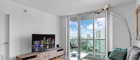 Beach Getaway: Modern 2BR Condo Pool & Gym Access (7814)