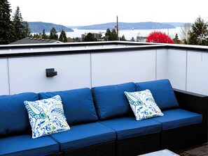 Breathtaking views from the private rooftop deck overlooking the Puget Sound.