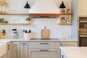 Kitchen has olive oil, vinegar, spices and seasonings, coffee, sugar, and others
