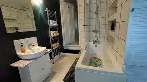 First floor main bathroom + toilet + rad + towels + handwash basin