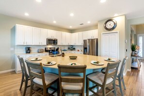 Imagine starting your day in a cheerful and functional kitchen with a breakfast island that's perfectly suited for families.