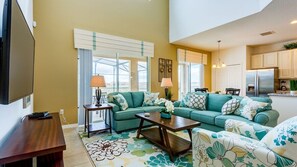 This stunning Florida villa features an open-plan living area, designed to create a spacious, airy, and inviting environment where comfort and style seamlessly blend.