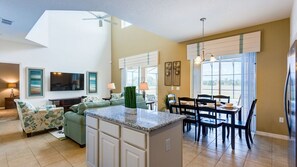 The elegant dining room, conveniently located just off the kitchen, offers the perfect setting for family meals, special gatherings, or intimate dinner parties.