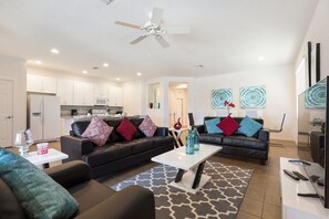 The open layout connects the living, dining, and kitchen areas, making it ideal for both relaxation and entertaining.